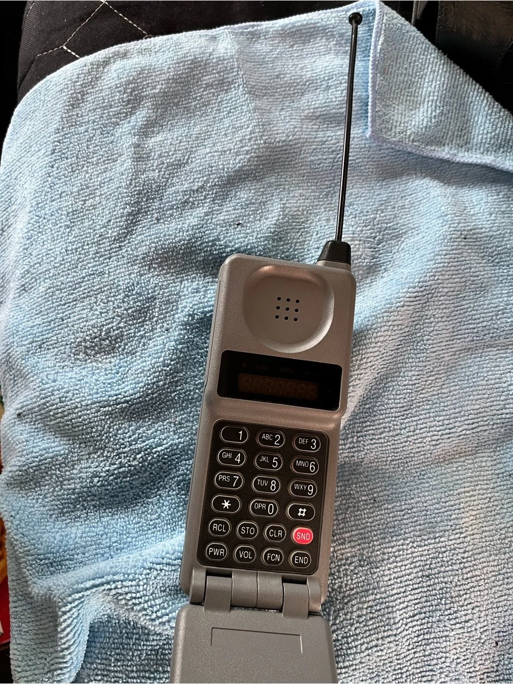 Motorola Silver Flip Phone with Numeric Keypad and Antenna